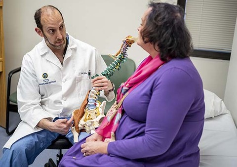 Dr. Erik Shaw with patient at the Shepherd Spine and Pain Institute